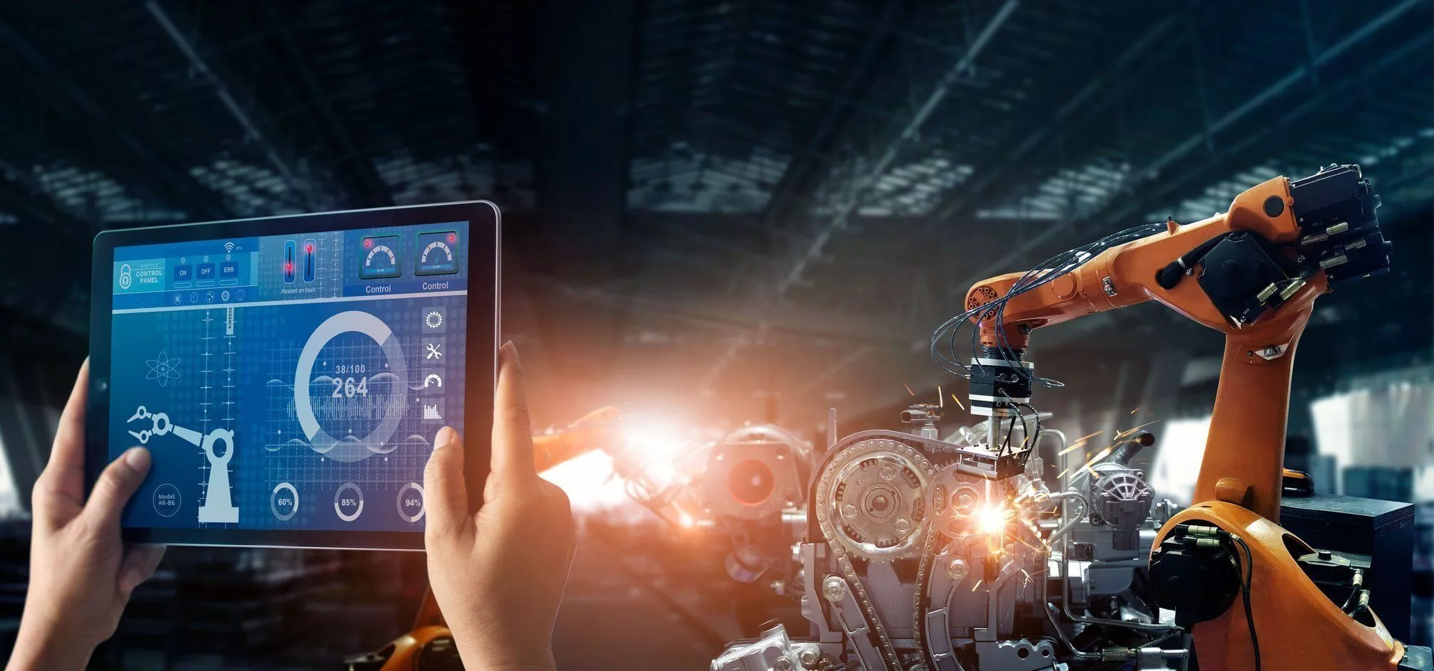 Engineer check and control welding robotics automatic arms machine in intelligent factory automotive industrial with monitoring system software. Digital manufacturing operation. Industry 4.0